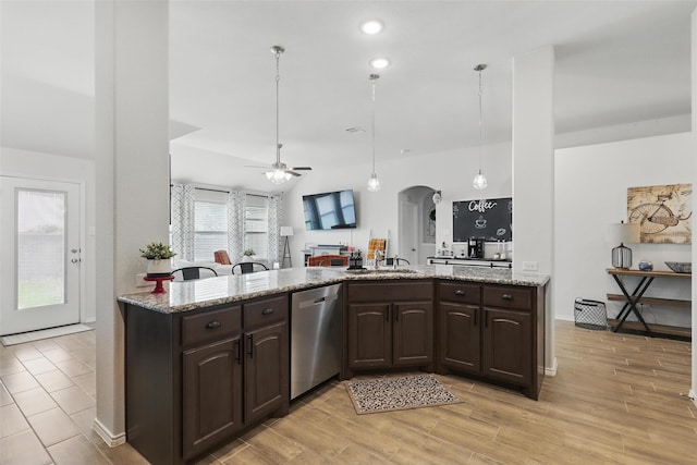 725 Sandy Chip Trl, Fort Worth, TX 76108 - kitchen with dishwasher, dark brown cabinets, arched walkways, a ceiling fan, and light wood-type flooring