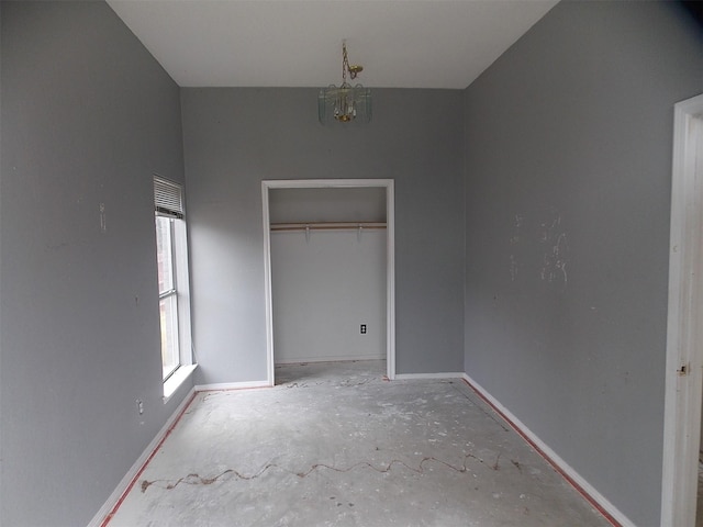 6107 Brookfall Dr, Arlington, TX 76018 - unfurnished bedroom with a chandelier, baseboards, and a closet
