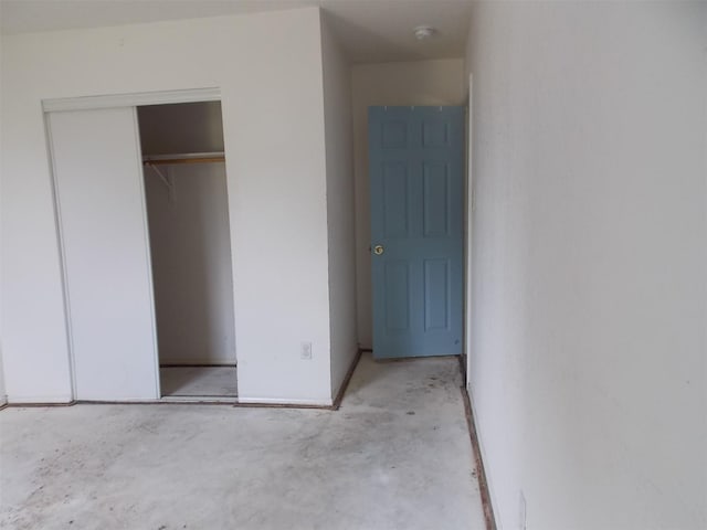 6107 Brookfall Dr, Arlington, TX 76018 - unfurnished bedroom with unfinished concrete floors and a closet