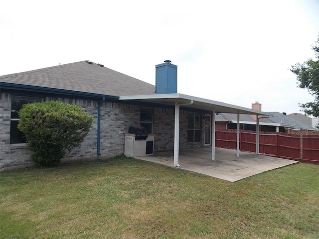 6107 Brookfall Dr, Arlington, TX 76018 - back of property featuring a patio, a chimney, and roof with shingles