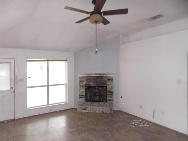 6107 Brookfall Dr, Arlington, TX 76018 - unfurnished living room featuring vaulted ceiling, ceiling fan, and a stone fireplace