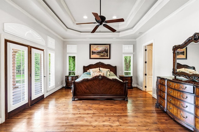 620 Timber Creek Cir, Stephenville, TX 76401 - bedroom with access to exterior, wood finished floors, a raised ceiling, ornamental molding, and recessed lighting
