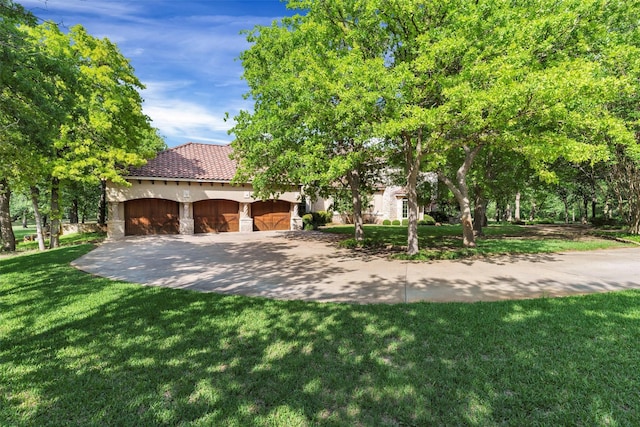 620 Timber Creek Cir, Stephenville, TX 76401 - view of front of property with stucco siding, an attached garage, a front yard, a tiled roof, and stone siding