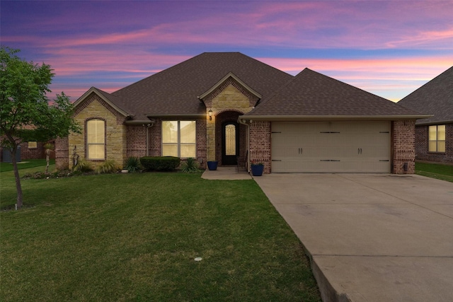 3102 White Horse Ct, Granbury, TX 76049 - french country home featuring driveway, brick siding, a garage, and a front yard