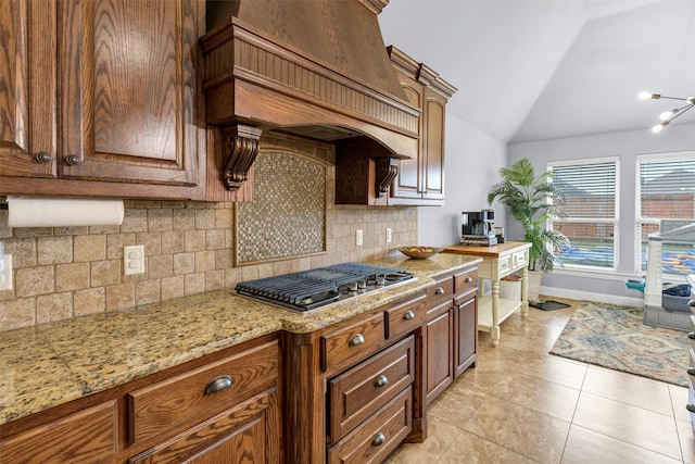 3102 White Horse Ct, Granbury, TX 76049 - kitchen with custom range hood, stainless steel gas cooktop, backsplash, lofted ceiling, and baseboards