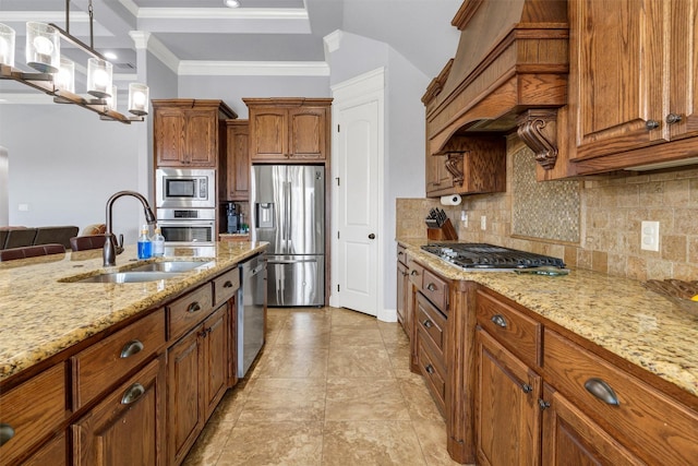 3102 White Horse Ct, Granbury, TX 76049 - kitchen with appliances with stainless steel finishes, a sink, custom exhaust hood, brown cabinets, and ornamental molding