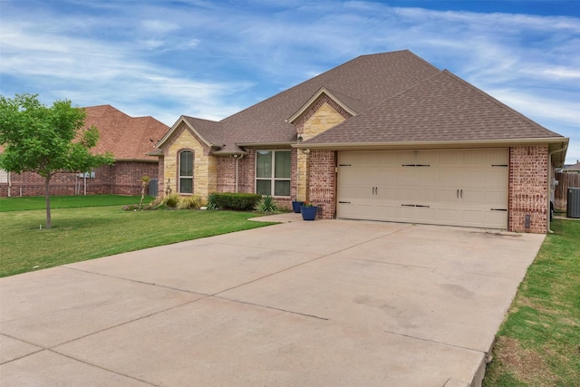 3102 White Horse Ct, Granbury, TX 76049 - view of front of property featuring driveway, brick siding, a front yard, a garage, and cooling unit