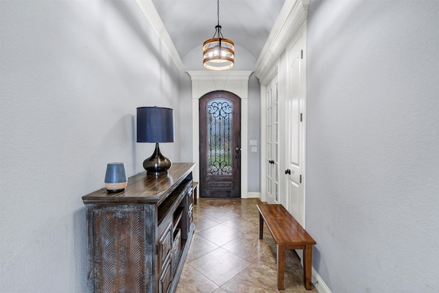 3102 White Horse Ct, Granbury, TX 76049 - foyer entrance with lofted ceiling, baseboards, tile patterned flooring, a chandelier, and arched walkways