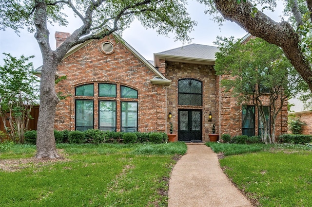 4605 Adrian Way, Plano, TX 75024 - traditional home with french doors, brick siding, and a chimney