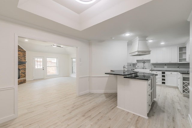 4107 Crossgate Ct, Arlington, TX 76016 - kitchen featuring custom range hood, white cabinets, light wood finished floors, dark countertops, and recessed lighting