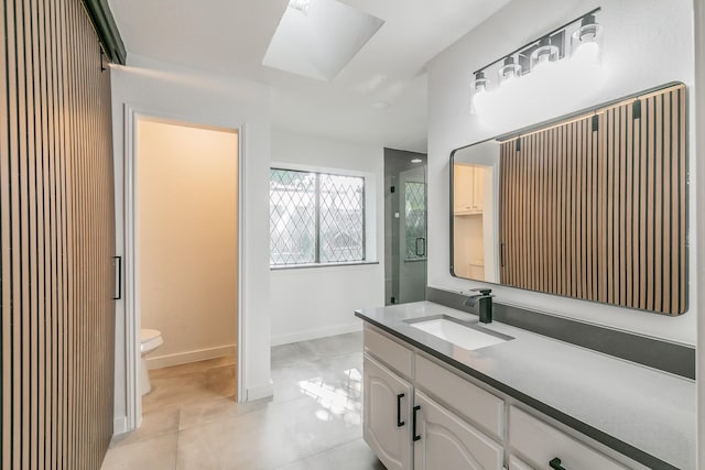 4107 Crossgate Ct, Arlington, TX 76016 - bathroom featuring toilet, a skylight, vanity, tile patterned floors, and a shower