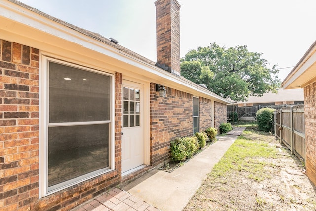 4107 Crossgate Ct, Arlington, TX 76016 - entrance to property with brick siding and a chimney