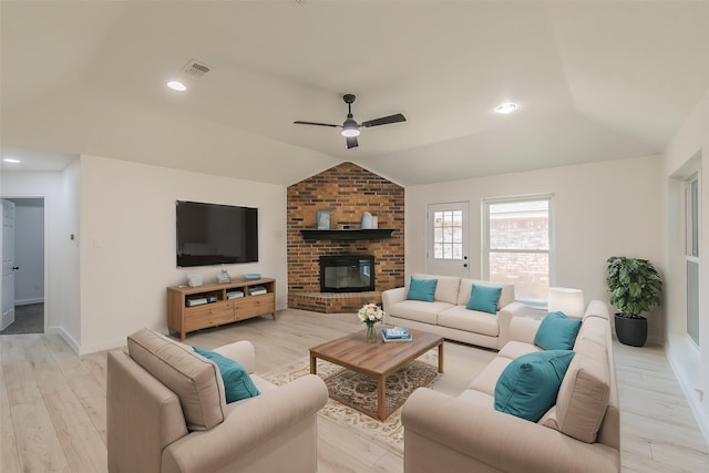 4107 Crossgate Ct, Arlington, TX 76016 - living room with vaulted ceiling, ceiling fan, light wood-style flooring, a fireplace, and baseboards