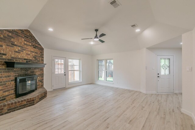 4107 Crossgate Ct, Arlington, TX 76016 - unfurnished living room with vaulted ceiling, a ceiling fan, wood finished floors, baseboards, and a brick fireplace