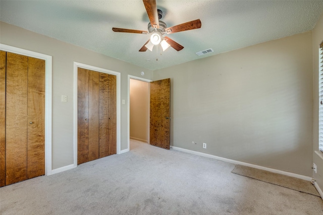 146 Circle Dr, Denison, TX 75021 - unfurnished bedroom with carpet flooring, baseboards, and a ceiling fan