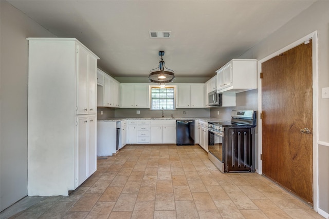 146 Circle Dr, Denison, TX 75021 - kitchen with stainless steel appliances, a sink, white cabinetry, and light countertops