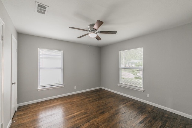 1209 Ralph St, Grand Prairie, TX 75051 - empty room with ceiling fan, dark wood-style floors, and baseboards