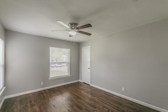 1209 Ralph St, Grand Prairie, TX 75051 - empty room with a ceiling fan, baseboards, and dark wood-style flooring