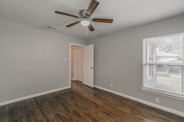 1209 Ralph St, Grand Prairie, TX 75051 - empty room featuring baseboards, ceiling fan, and dark wood finished floors