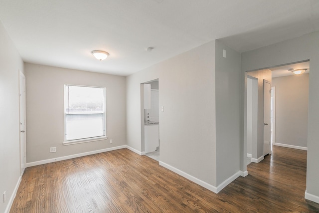 1209 Ralph St, Grand Prairie, TX 75051 - unfurnished room with wood finished floors and baseboards
