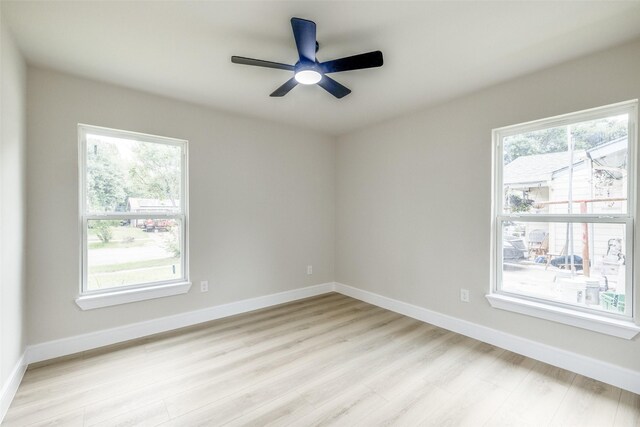 1218 Ralph St, Grand Prairie, TX 75051 - unfurnished room with light wood-style flooring, plenty of natural light, and ceiling fan