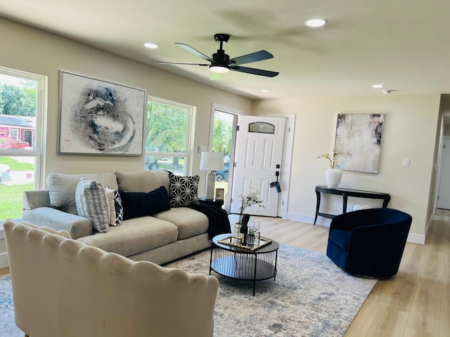 1218 Ralph St, Grand Prairie, TX 75051 - living room featuring healthy amount of natural light, light wood-style flooring, a ceiling fan, and recessed lighting