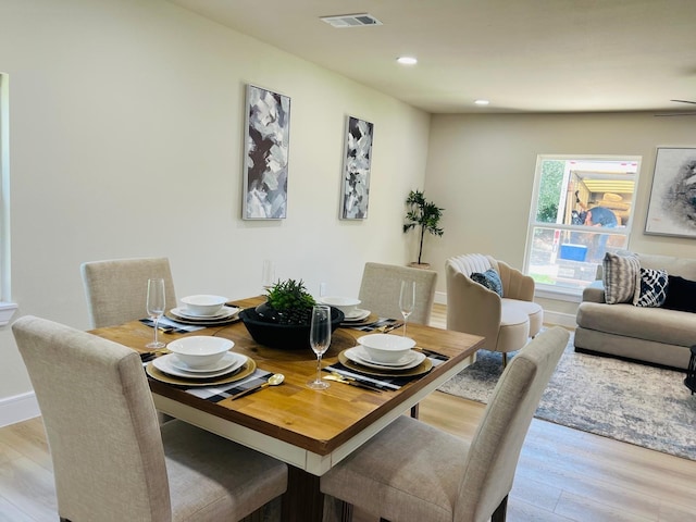 1218 Ralph St, Grand Prairie, TX 75051 - dining space with wood finished floors and recessed lighting