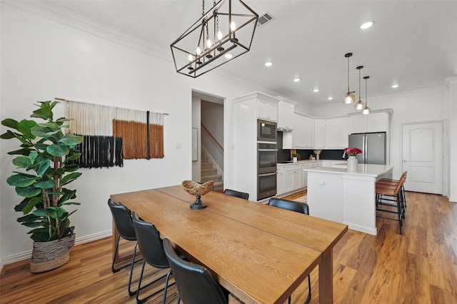 917 County Road 914, Burleson, TX 76028 - dining area with ornamental molding, stairs, light wood-type flooring, recessed lighting, and baseboards
