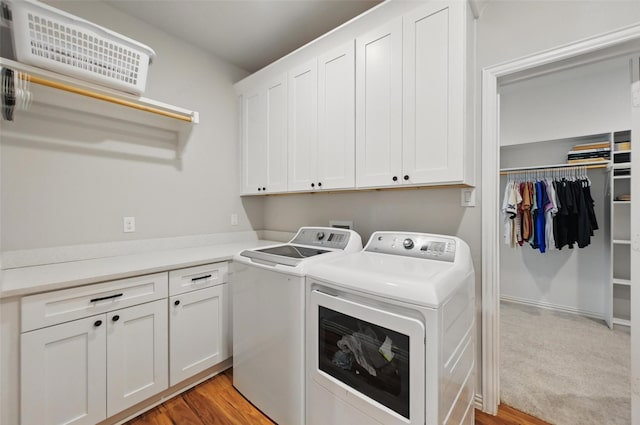 917 County Road 914, Burleson, TX 76028 - clothes washing area with cabinet space, washer and dryer, and light wood-type flooring