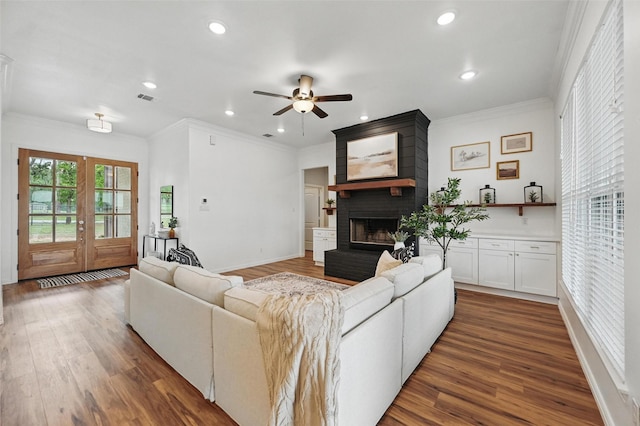 917 County Road 914, Burleson, TX 76028 - living room featuring a ceiling fan, crown molding, a fireplace, recessed lighting, and wood finished floors