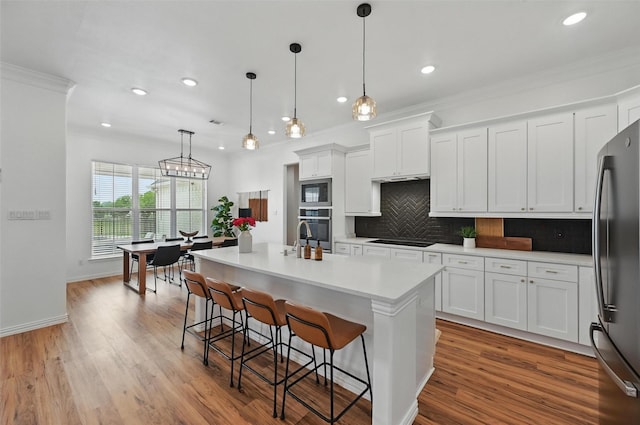 917 County Road 914, Burleson, TX 76028 - kitchen featuring stainless steel appliances, tasteful backsplash, recessed lighting, light countertops, and white cabinets