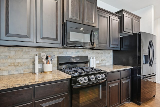 3454 Eloise Ln, Krum, TX 76249 - kitchen featuring black appliances, dark brown cabinets, light wood-type flooring, and backsplash