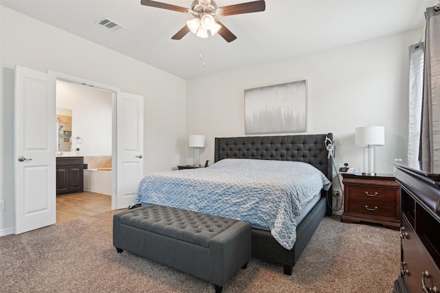 3454 Eloise Ln, Krum, TX 76249 - carpeted bedroom featuring ensuite bathroom and a ceiling fan