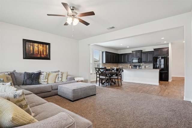 3454 Eloise Ln, Krum, TX 76249 - living room featuring ceiling fan, light wood-style floors, baseboards, and recessed lighting