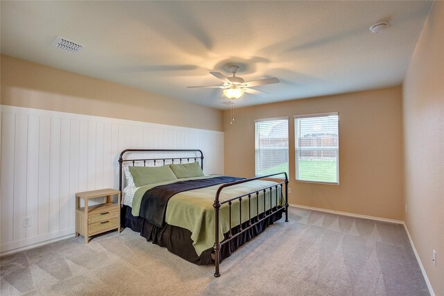 1908 Damianita Dr, Royse City, TX 75189 - carpeted bedroom featuring a ceiling fan, baseboards, and a wainscoted wall