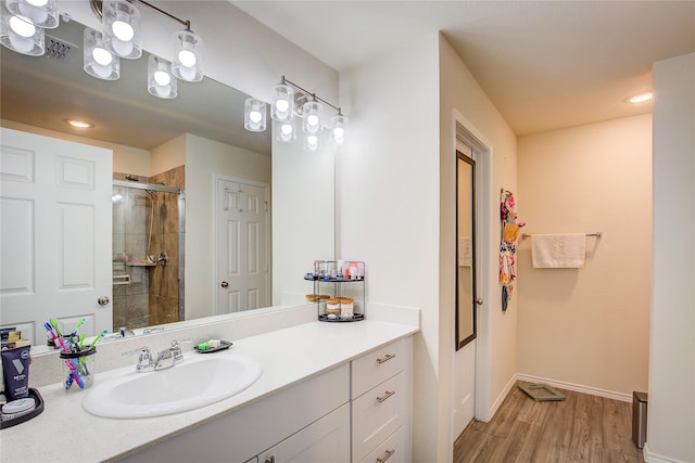 1908 Damianita Dr, Royse City, TX 75189 - full bathroom with a stall shower, wood finished floors, vanity, and baseboards