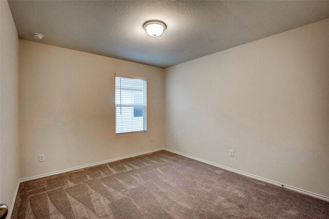 1908 Damianita Dr, Royse City, TX 75189 - spare room with carpet, a smoke detector, and baseboards