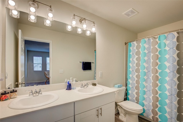 1908 Damianita Dr, Royse City, TX 75189 - bathroom with double vanity, toilet, and a shower with curtain