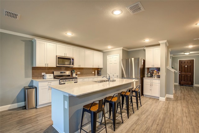 1908 Damianita Dr, Royse City, TX 75189 - kitchen featuring stainless steel appliances, a sink, crown molding, baseboards, and decorative backsplash