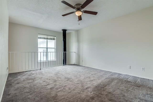 4211 Holland Ave Unit 206, Dallas, TX 75219 - carpeted empty room featuring a textured ceiling and ceiling fan