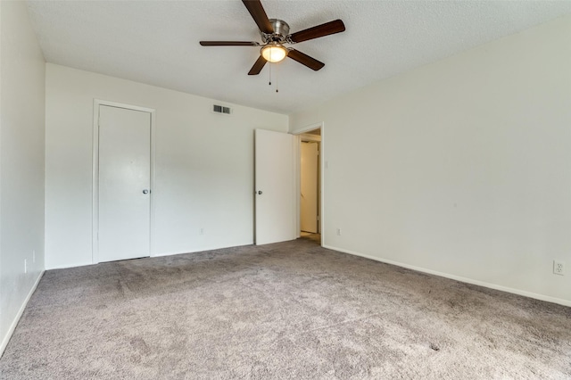 4211 Holland Ave Unit 206, Dallas, TX 75219 - unfurnished bedroom featuring carpet flooring and a ceiling fan