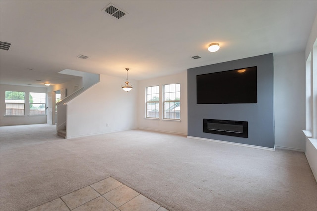 1300 Wind Star Way, Fort Worth, TX 76108 - unfurnished living room with light carpet, stairway, plenty of natural light, and baseboards