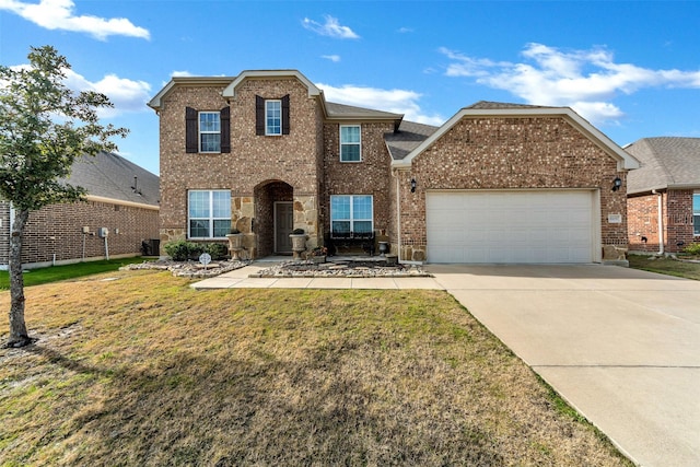 8109 Brahmin Ct, Fort Worth, TX 76131 - traditional-style home featuring a garage, driveway, brick siding, and a front lawn