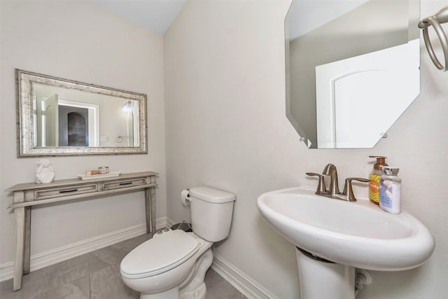 8109 Brahmin Ct, Fort Worth, TX 76131 - bathroom featuring toilet, a sink, and baseboards