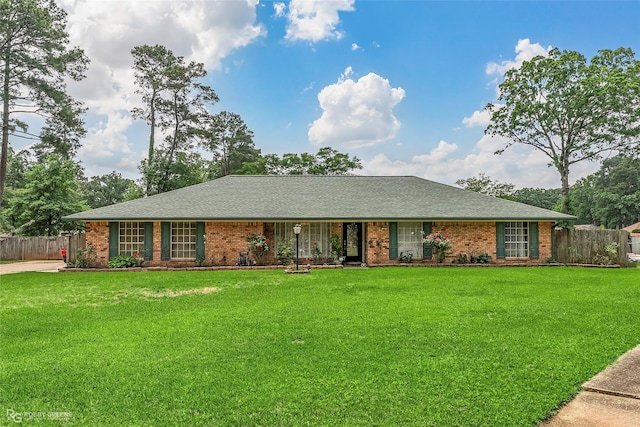 ranch-style home featuring brick siding and a shingled roof