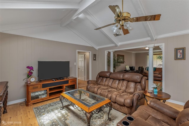 living room with ornate columns, light wood-style floors, and a ceiling fan