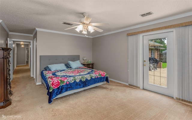 carpeted bedroom featuring access to exterior, baseboards, a textured ceiling, ornamental molding, and a ceiling fan