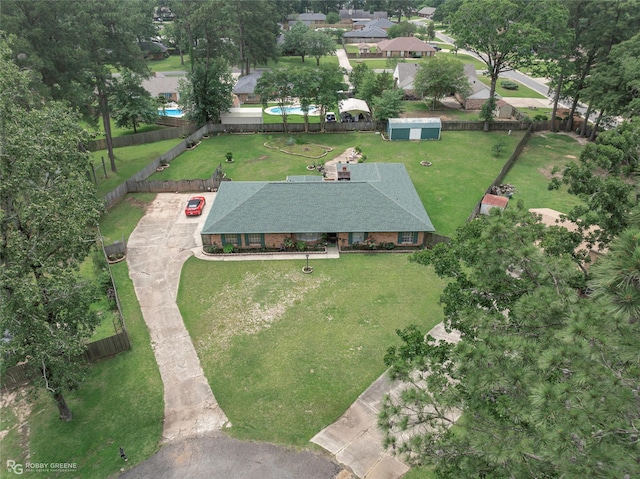 aerial view of property and surrounding area with a pool area