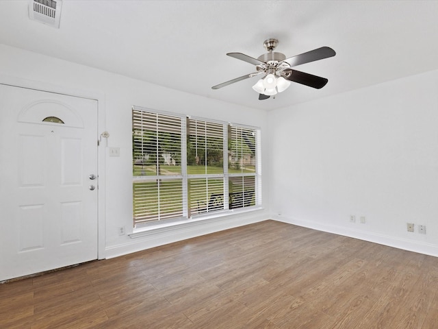 511 Wildwood Dr, Mesquite, TX 75149 - foyer entrance with wood finished floors, ceiling fan, and baseboards