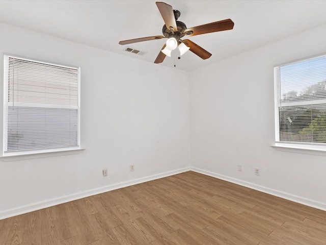 511 Wildwood Dr, Mesquite, TX 75149 - unfurnished room with light wood-style flooring, ceiling fan, and baseboards